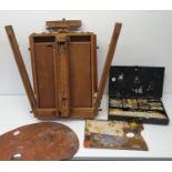 An artist's portable easel, a watercolour set and two paint palettes (4) No makers mark to