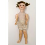 A Simon & Halbig German bisque headed doll, No 1009-6, a composite jointed body, and closing