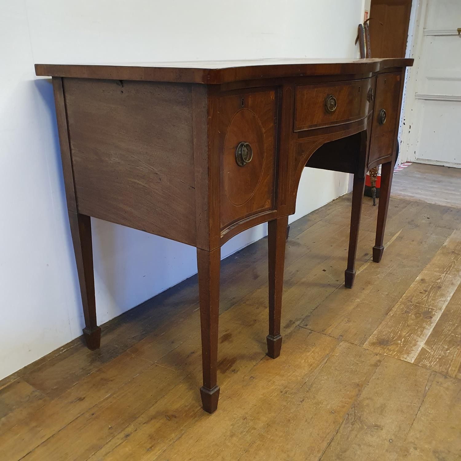 A 19th century mahogany serpentine sideboard, with a single drawer flanked by a cupboard door and - Image 6 of 7