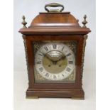 An 18th century style bracket clock, the arched brass dial signed Thomas Smith, London, with a