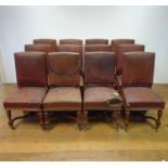 A set of twelve late 19th century French walnut framed dining chairs, with leather padded backs