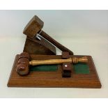 A Masonic gavel and base, and another gavel and base