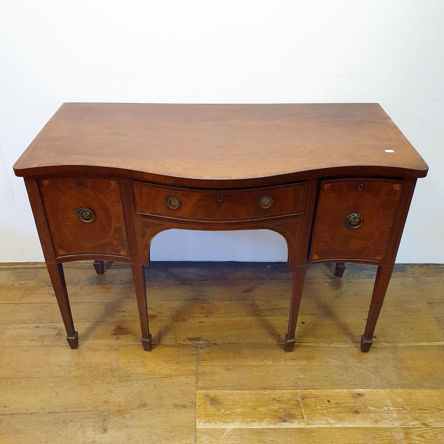 A 19th century mahogany serpentine sideboard, with a single drawer flanked by a cupboard door and - Image 2 of 7