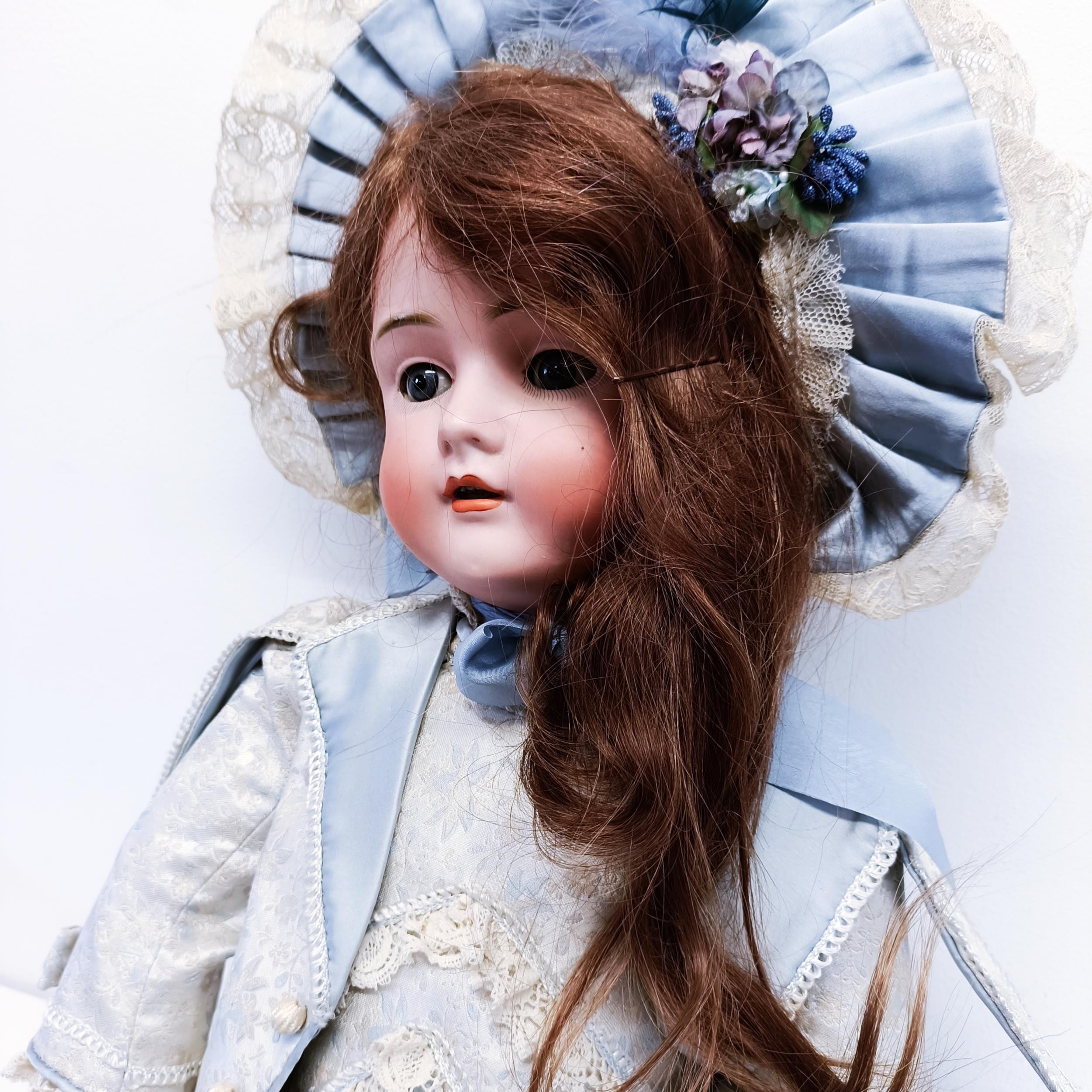 A German bisque headed doll, makers mark BSW, with a jointed composite body, millefiori closing - Image 2 of 6
