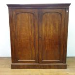 A 19th century mahogany two door wardrobe, the two doors to reveal eight drawers, 142 cm wide