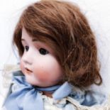 A German bisque headed doll, makers mark BSW, with a jointed composite body, millefiori closing