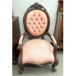 A 19th century style mahogany framed open armchair, with a button back, padded arms and seat Various