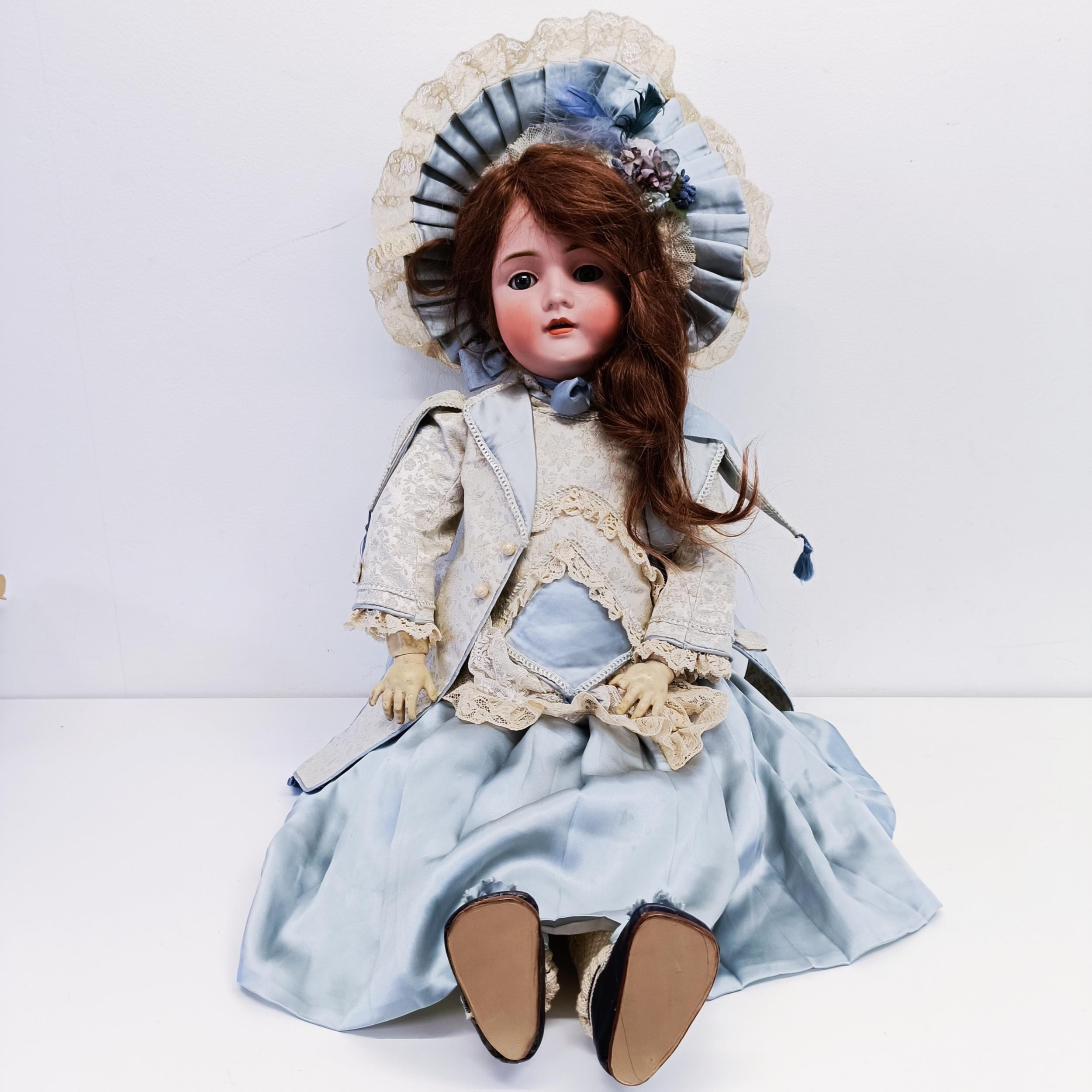 A German bisque headed doll, makers mark BSW, with a jointed composite body, millefiori closing - Image 3 of 6