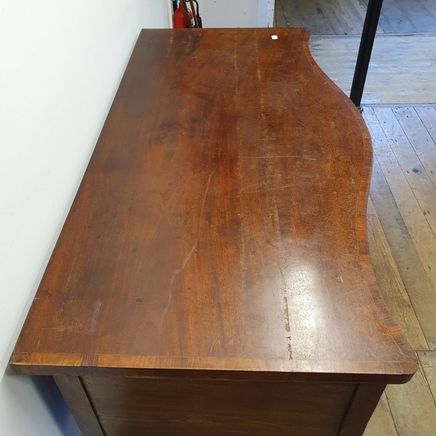 A 19th century mahogany serpentine sideboard, with a single drawer flanked by a cupboard door and - Image 5 of 7