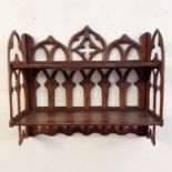 A Gothic oak wall shelf, 42 cm wide