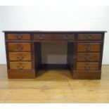 A mahogany pedestal desk, of a nine drawer configuration, 150 cm wide Leather top has been