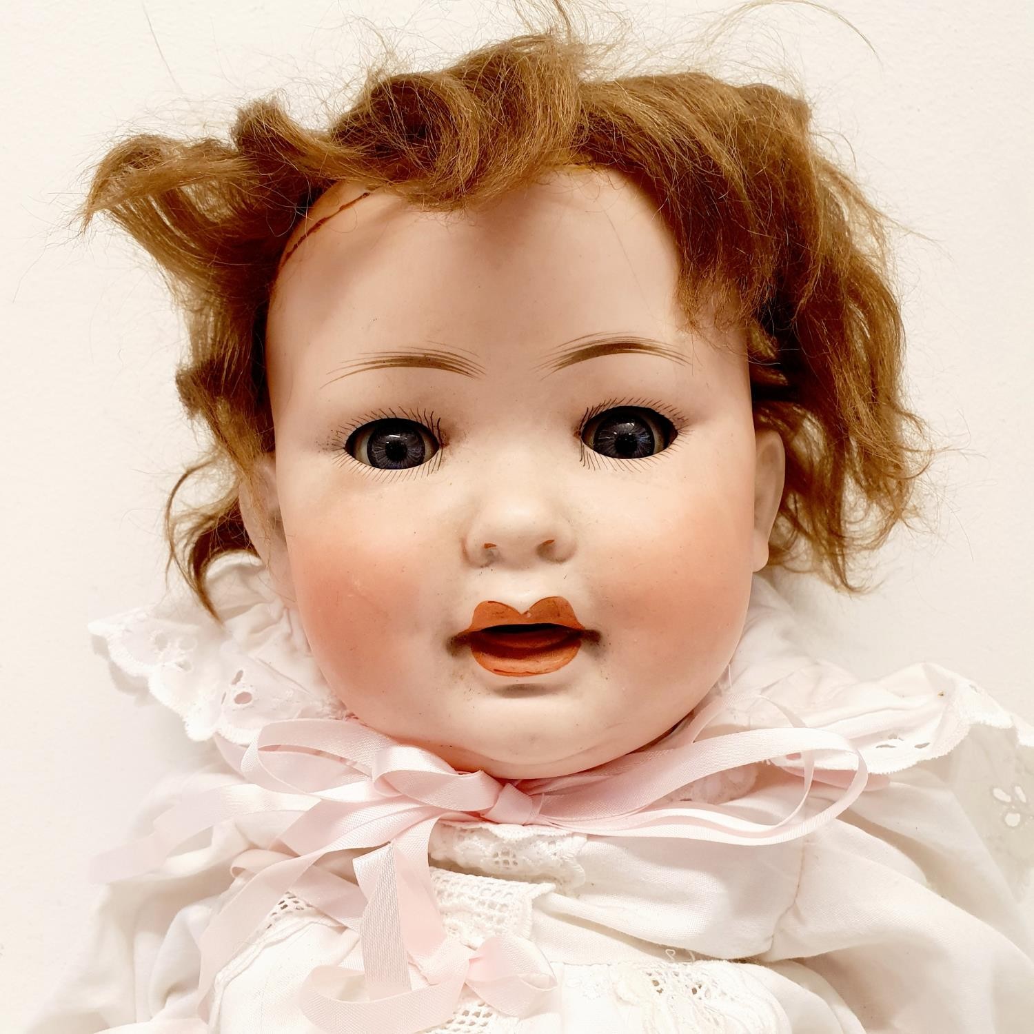 A German bisque headed doll, makers mark PM No 914, with a composite body and millefiori glass - Image 2 of 4