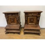 A pair of 19th century Continental walnut bedside chests, with carved figural mounts, on a base with