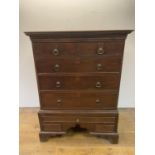 An oak chest on stand, the top having two short and three long drawers, on a base with three