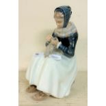 A Royal Copenhagen figure, of a woman, 24 cm high No chips cracks or restoration