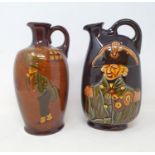 A Royal Doulton kingsware jug, decorated Nelson, 20 cm high, and another, decorated Dickens scene (
