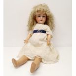 An Armand Marseille German bisque headed doll, No 90, with a composite jointed body, and