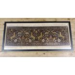 A Persian silk rug, multiple borders, the centre decorated animals, birds and flowers, framed and