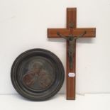 An early 20th century copper roundel, depicting Jesus and a child, in an ebonised frame, 27 cm