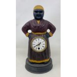 A novelty clock, in the form of a woman, in a painted metal case, 31 cm high Condition good, a