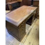 An oak pedestal desk, having a nine drawer configuration, 122 cm wide General wear and scratches