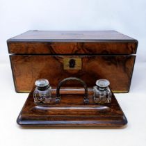 A 19th century walnut writing slope, 41 cm, and an oak desk stand, 29 cm wide