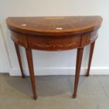 A Sheriton Revival folding demi-lune card table, with painted floral decoration, 92 cm wide Slight