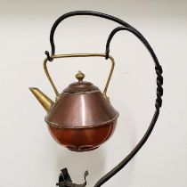 A Dr Christopher Dresser style copper kettle, on a wrought iron stand, 85 cm high