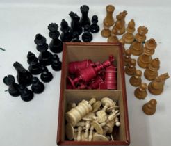 A red stained and natural bone chess set, the king 11 cm high, and a black and natural wood chess