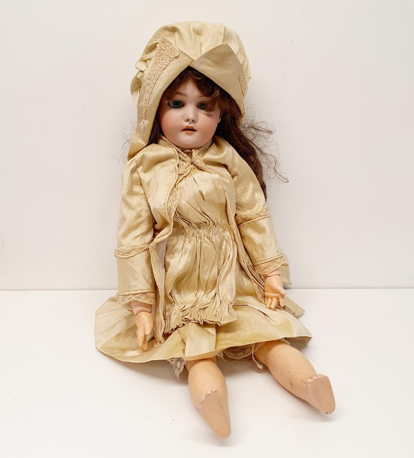 A Simon and Halbrich German bisque headed doll, No 9, with a jointed composite body, millefiori