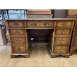 A mahogany pedastal desk, a dressing table, assorted furniture and two prints (10)