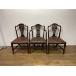 A set of seven George III sytyle mahogany dining chairs, with pierced vase shaped splat backs and