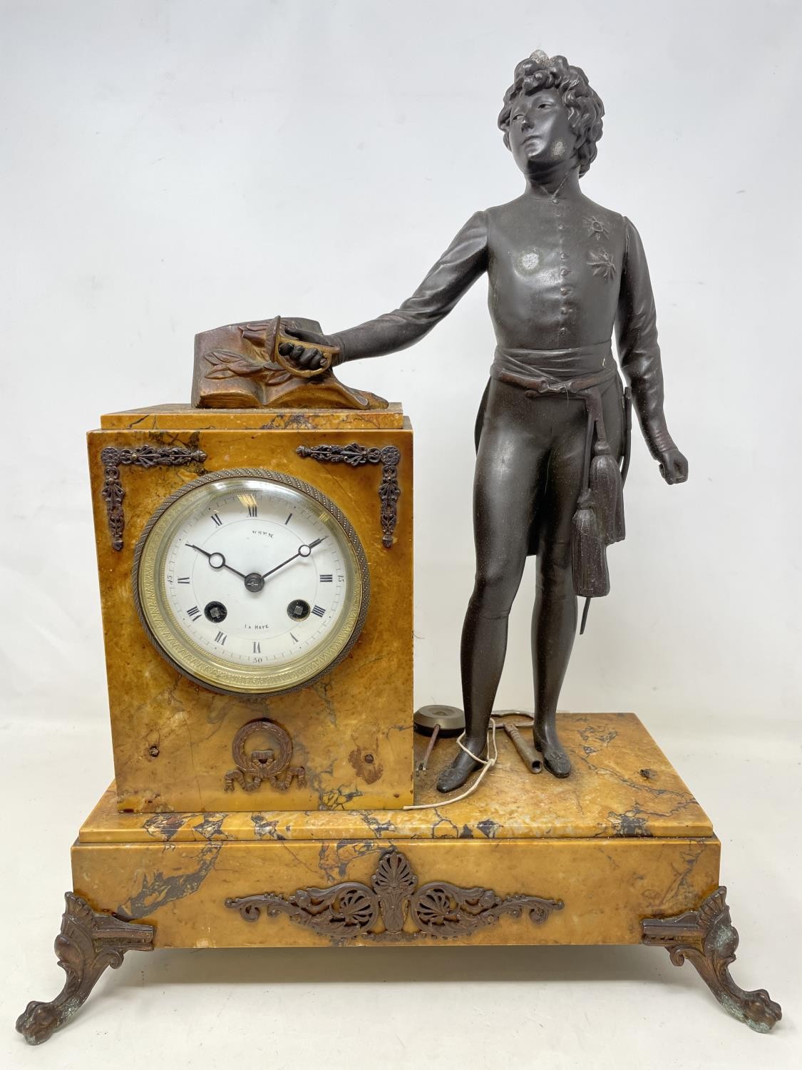 A late 19th/early 20th century French mantel clock, the 9 cm diameter enamel dial with Roman