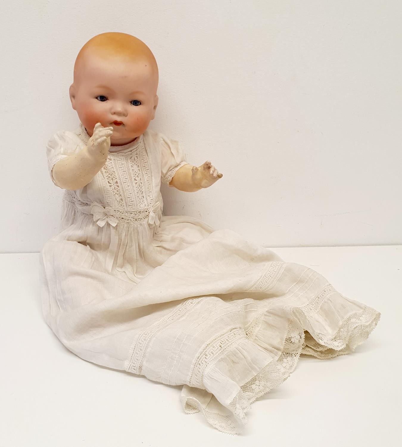 An Armand Marseille German bisque headed baby doll, No 341.14.K, with a composite body and