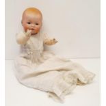 An Armand Marseille German bisque headed baby doll, No 341.14.K, with a composite body and