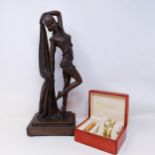 An Art Deco style figure of a lady, 43 cm high, a ladies Citizen wristwatch, and a matching