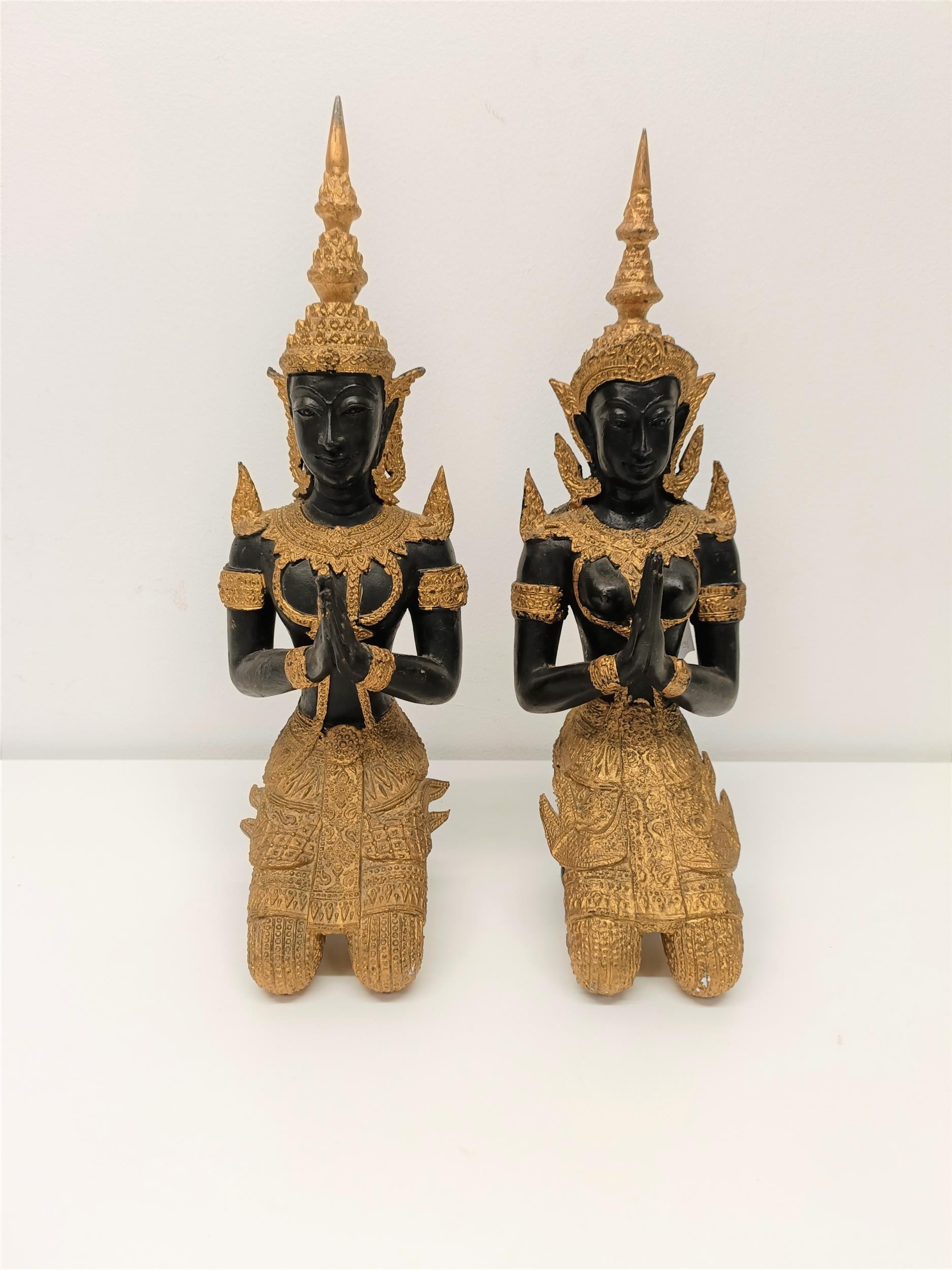 A pair of painted metal figures of goddesses, 33 cm high