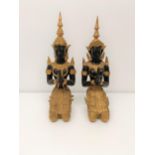 A pair of painted metal figures of goddesses, 33 cm high