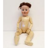 A Porzellanfabrik-Burggrub German bisque headed doll, with a jointed composite body, and
