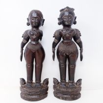 A pair of carved wood Eastern figures, 40 cm high (2) One lacking arm, various losses