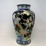 A Chinese vase, decorated blossom, 38 cm high Extensive damage