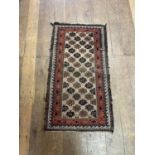 A Persian red ground rug, 213 x 122 cm, and a prayer mat, 114 x 63 cm (2) Very worn.