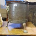A brass coal bin, with lion's head ring handles, on paw feet, 39 cm diameter Probably first