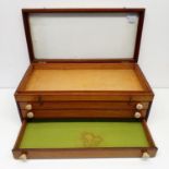 A late 19th/early 20th century mahogany table top collectors cabinet, with a hinged baize lid, above