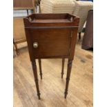A 19th century mahogany tray top stand, with a single cupboard door, 30 cm wide