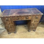 A late 19th century mahogany kneehole writing desk, of nine drawer configuration, 105 cm wide