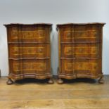 A pair of 19th century Italian walnut bombe chests, of small proportions, with boxwood inlay, having