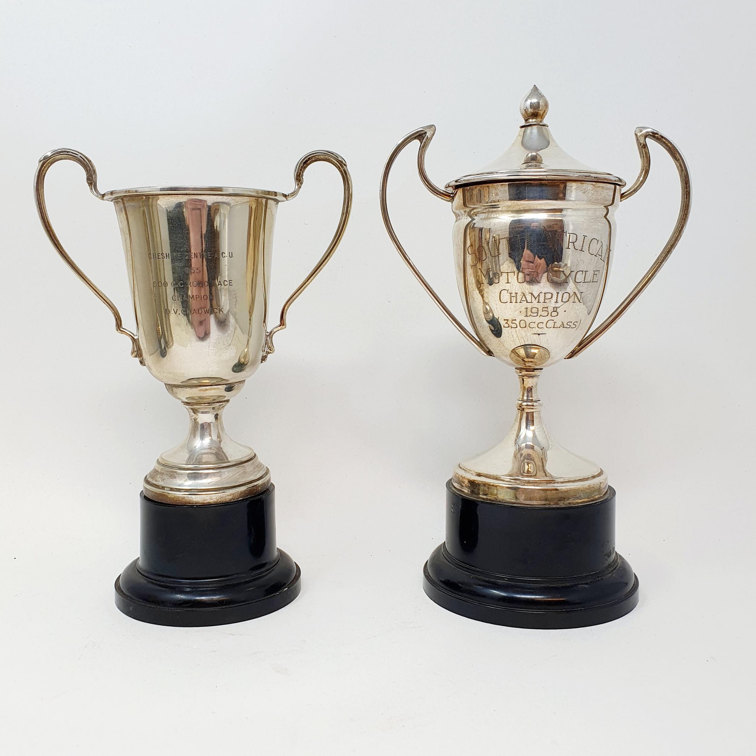 A silver plated cup, Cheshire Centre ACU 1955 500cc Road Race Champion D V Chadwick, on a plastic