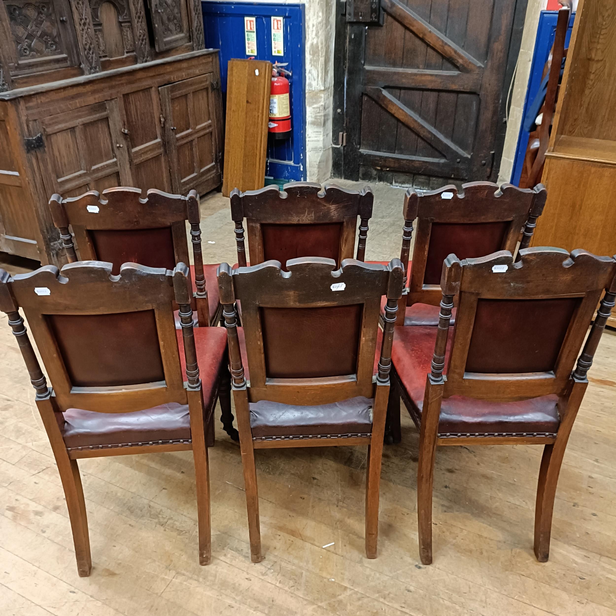 A set of six late 19th century carved walnut dining chairs, with leather padded backs and seats (6) - Image 7 of 11