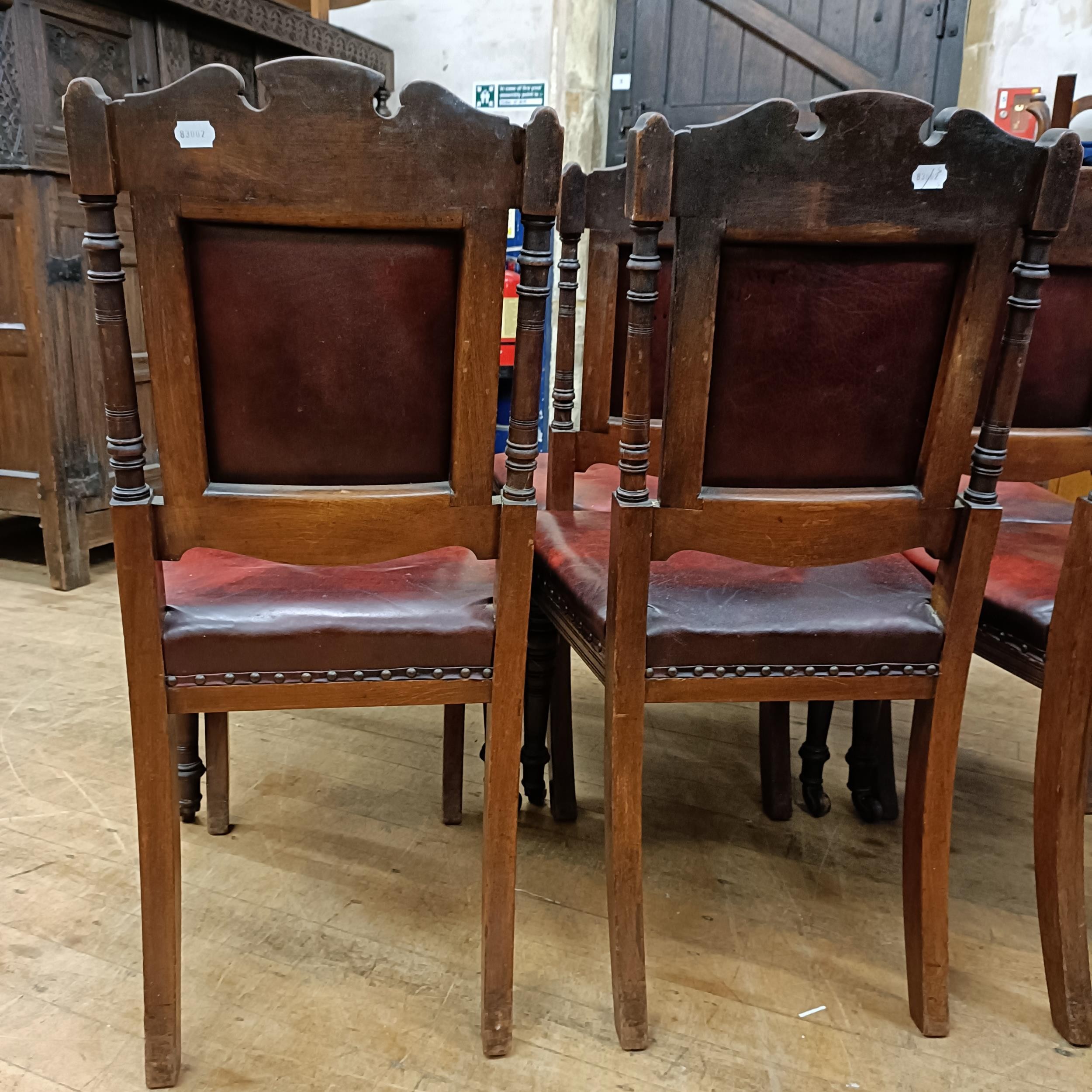 A set of six late 19th century carved walnut dining chairs, with leather padded backs and seats (6) - Image 8 of 11